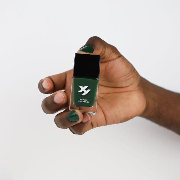 Model holding a bottle of Maverick X nail polish