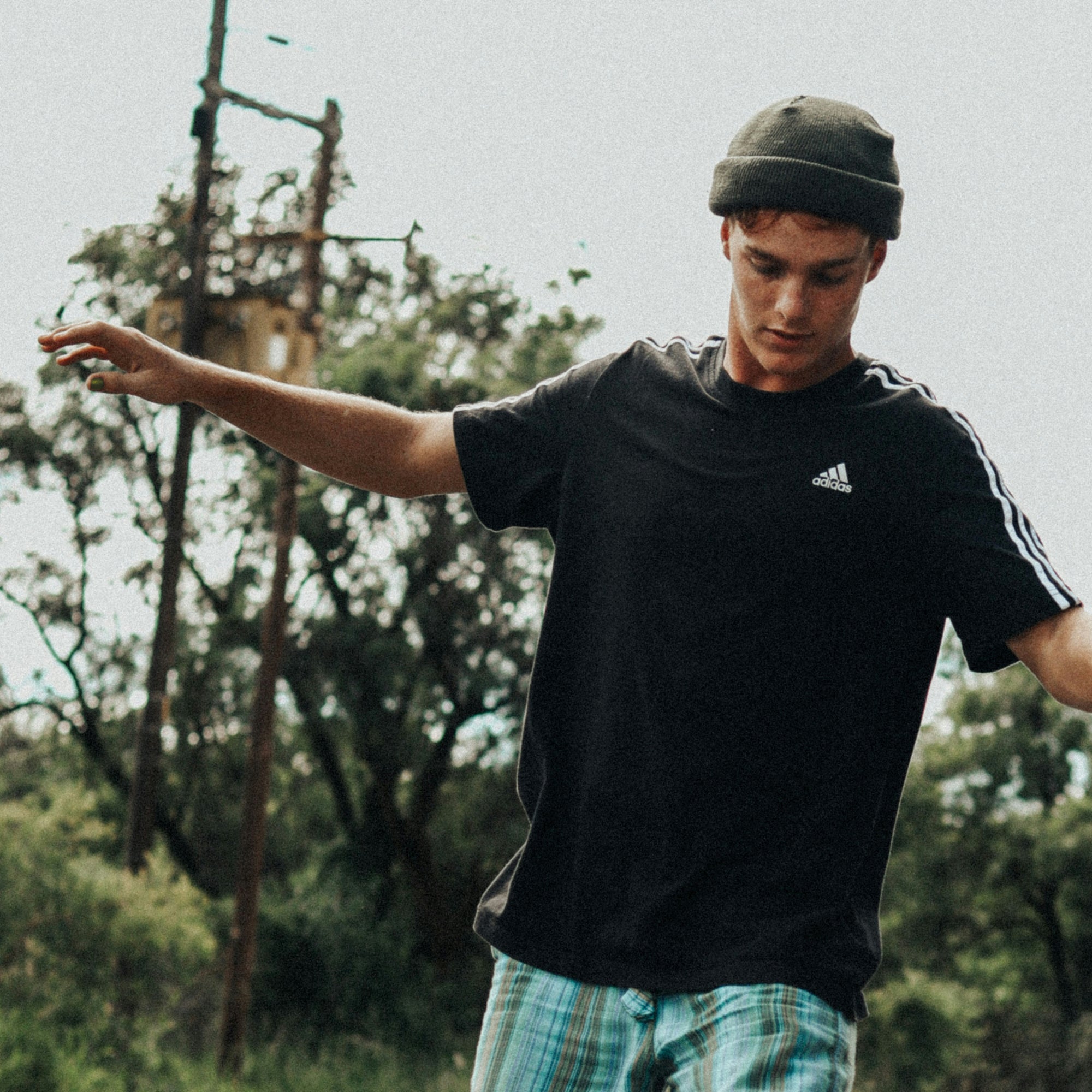 Man on a skateboard wearing Wanderer Y nail polish.