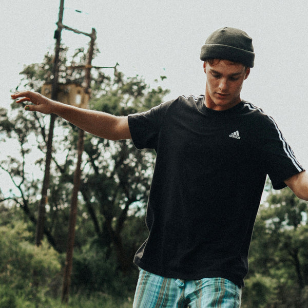 Man on a skateboard wearing Wanderer Y nail polish.