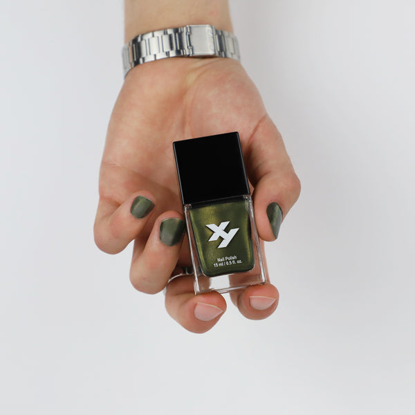 Model holding a bottle of Wanderer Y nail polish.